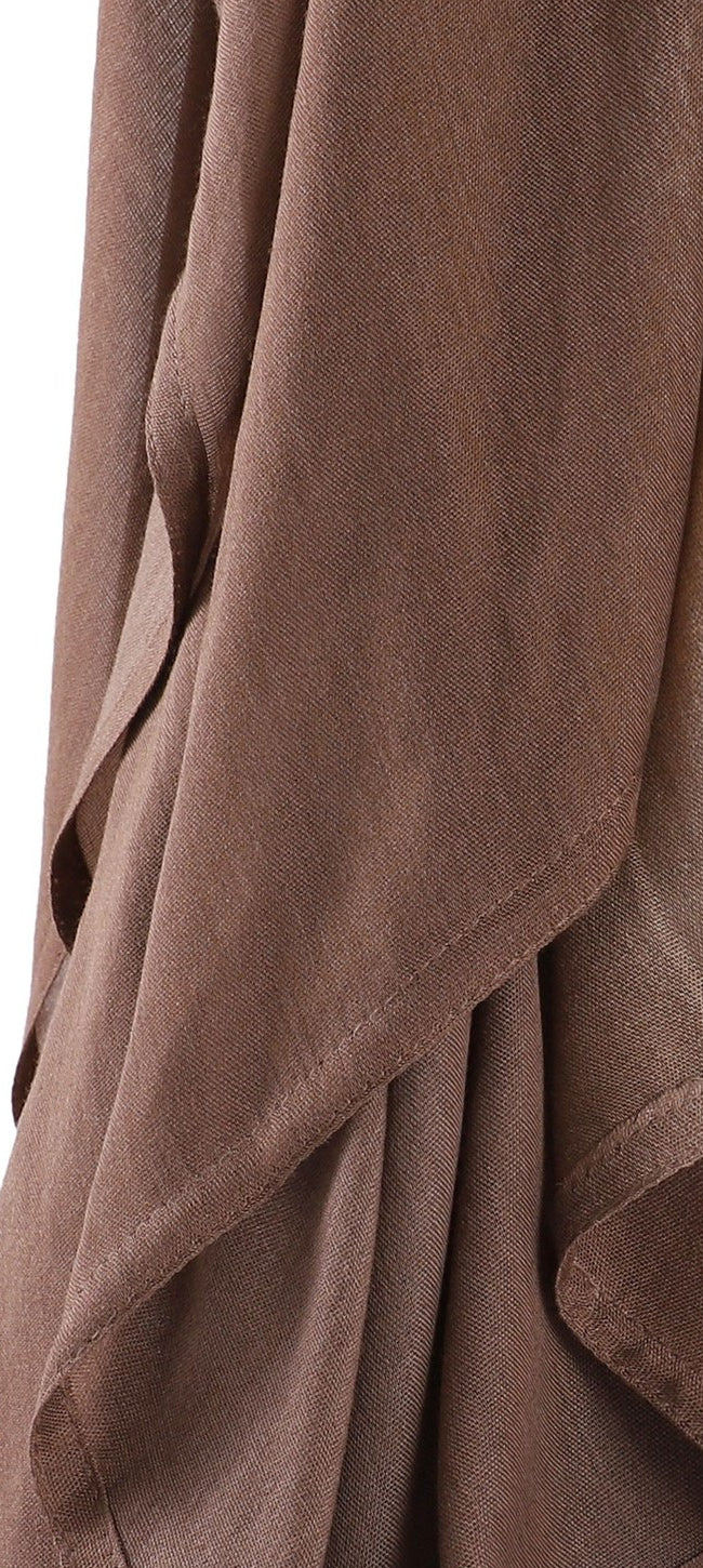 Close-up of a cocoa brown hijab draped in loose folds.