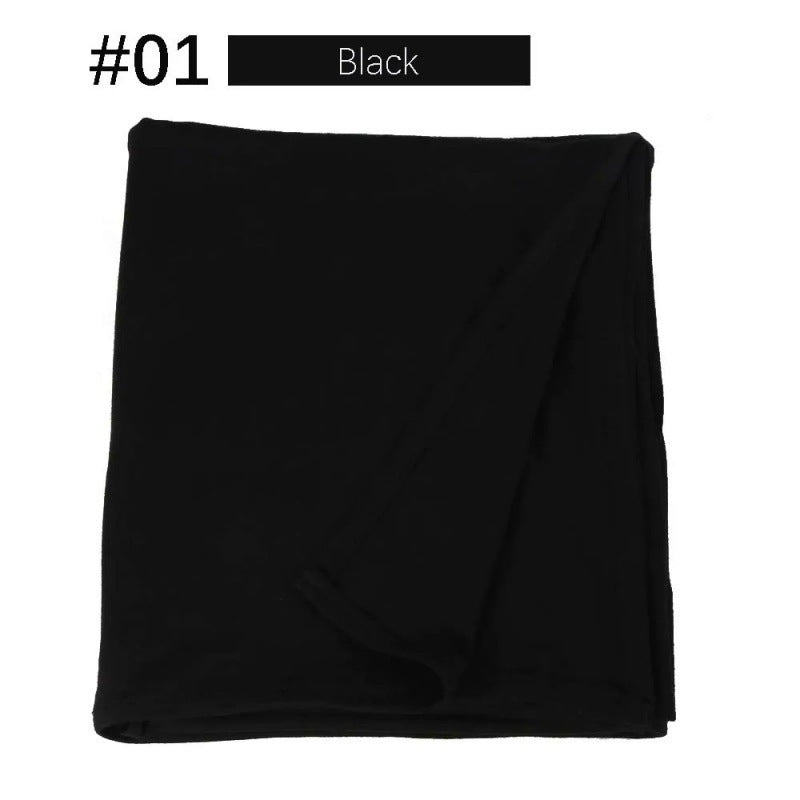 Black rectangular hijab folded on a white background.